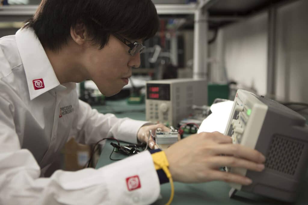 Precision Microdrives engineer is testing a motor using bespoke equipment