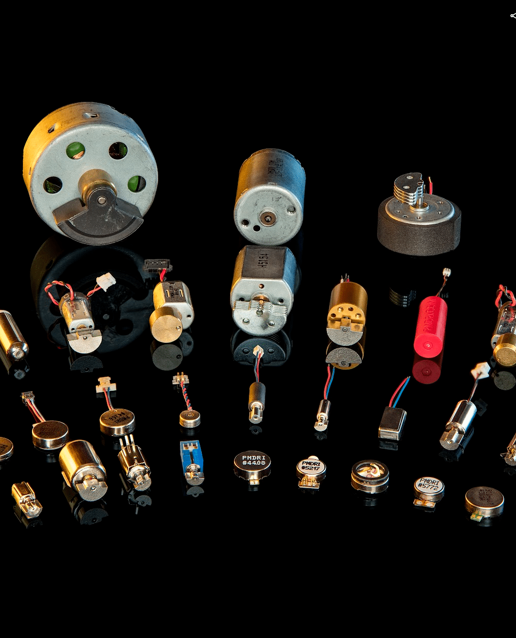 A selection of DC vibration motors displayed in an arch formation 