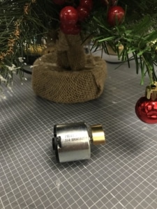 A vibration motor sat in front of the Christmas tree