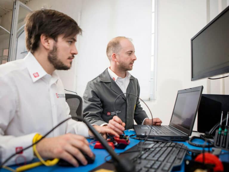 Precision Microdrives design engineers in our London office